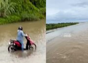 Salah Arah, Pengendara Sepeda Motor Malah Masuk Area Sungai yang Terhubung Laut Lepas