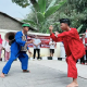 Jawara putra dan putri tampil silat dalam Rebut Dandang Cipayung Jaya 2026